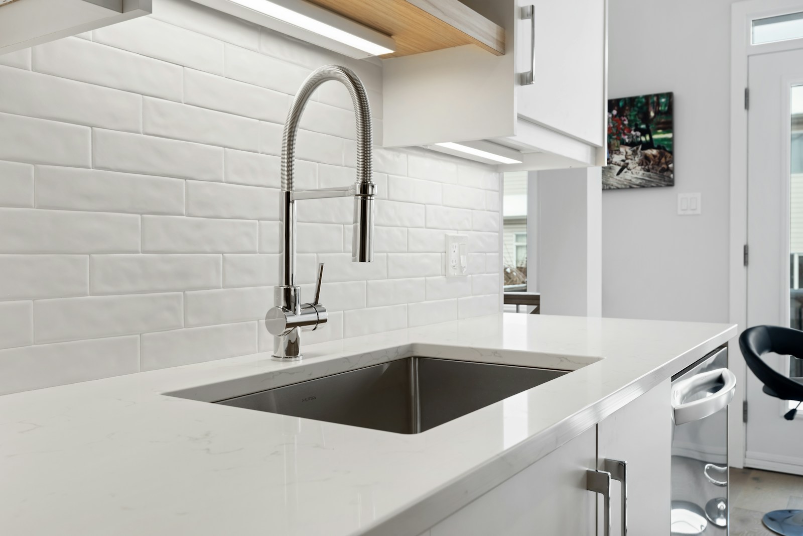 Kitchen sink and tap beside a window