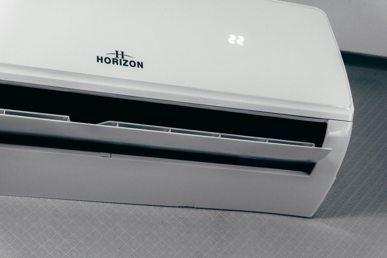 White indoor wall-mounted air-conditioning unit